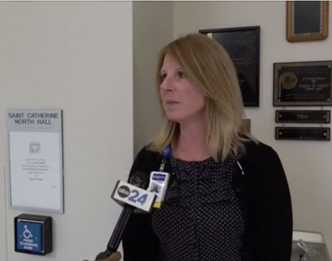 Healthcare professional giving news interview