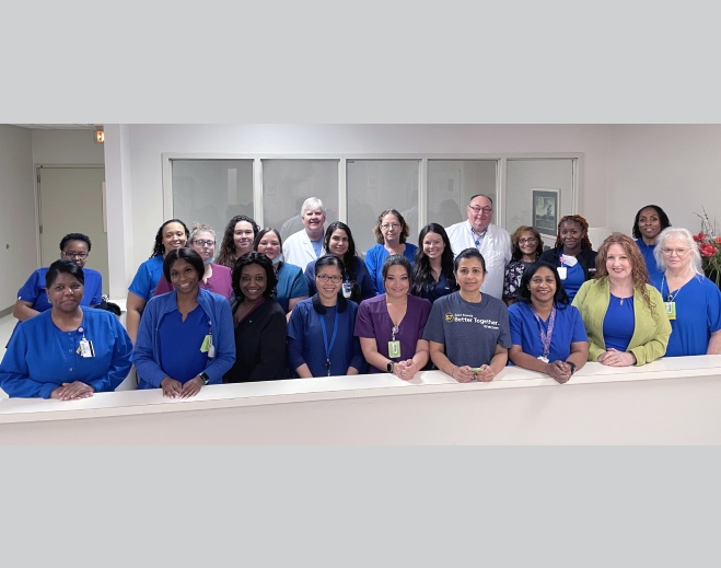 Large group of healthcare staff posing together